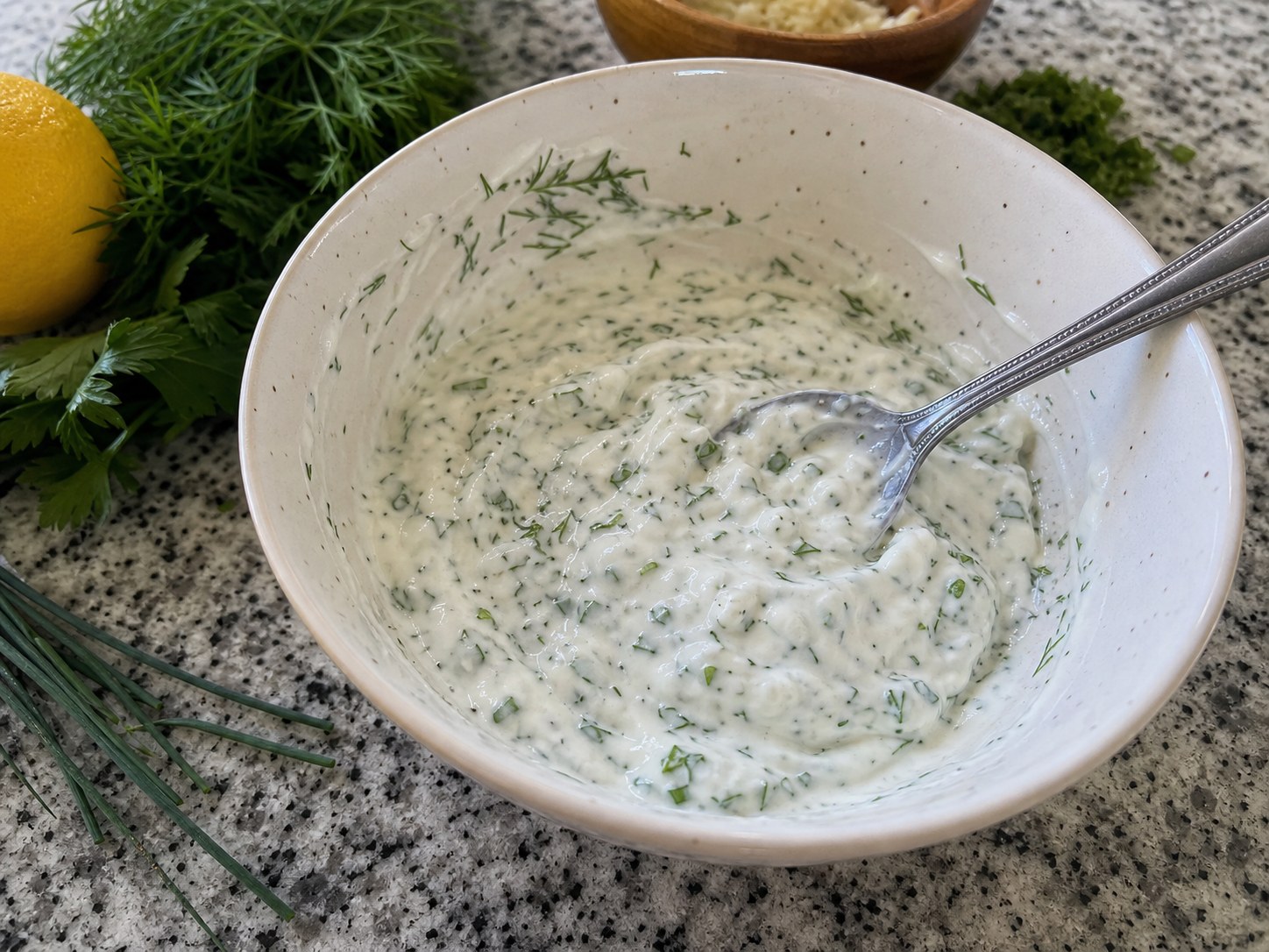 Thick Greek yogurt ranch base mixed with herbs, lemon, garlic, salt, and pepper.